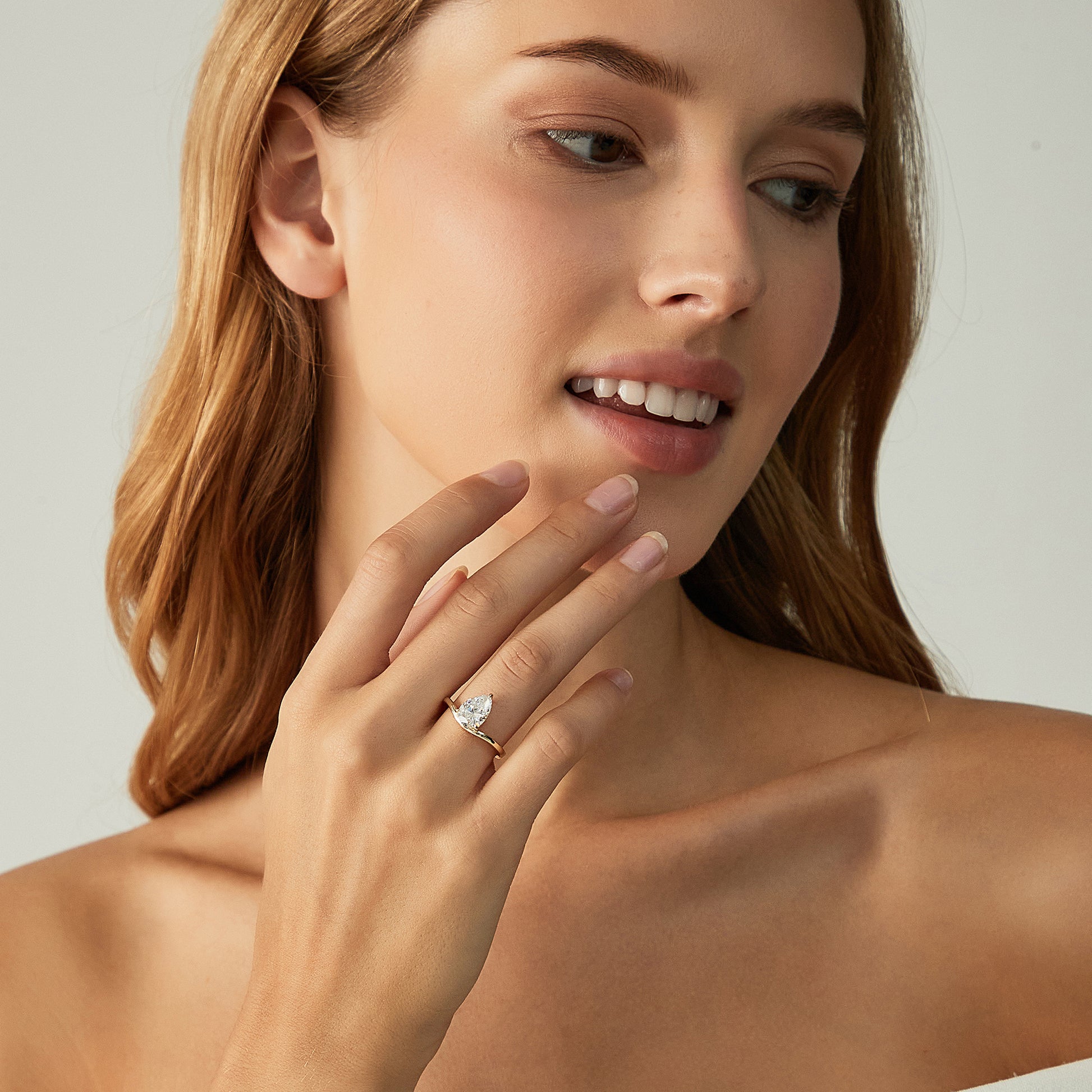 curved engagement rings, curved band, pear engagement rings, pear cut, cubic zirconia rings, cubic zirconia usa, travel rings, fake diamond rings, cz rings, affordable jewelry, gold engagement rings