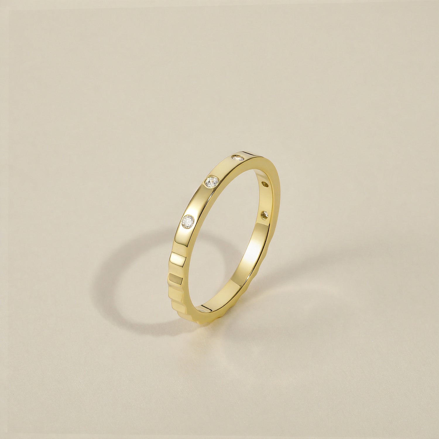 minimalist wedding band ring, 5A CZ band ring, modern promise ring, cubic zirconia Rings, cz ring, wedding rings cz, eamti rings, cheap wedding rings under $50, copper ring,stackable ring. Gold ring with small diamonds on a beige background