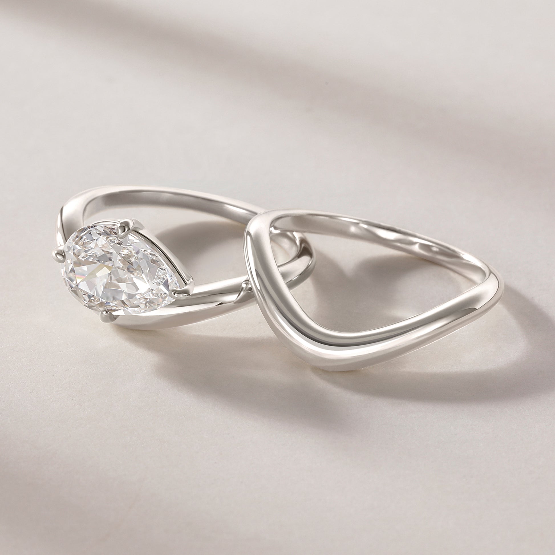 low profile engagement rings, statement rings, engagement ring and wedding band set, cz engagement ring set, cz ring, cz bridal ring sets, east west pear cut ring, cz bridal ring sets,ring set,thin band engagement ring, eamti, travel ring, eamti jewelry